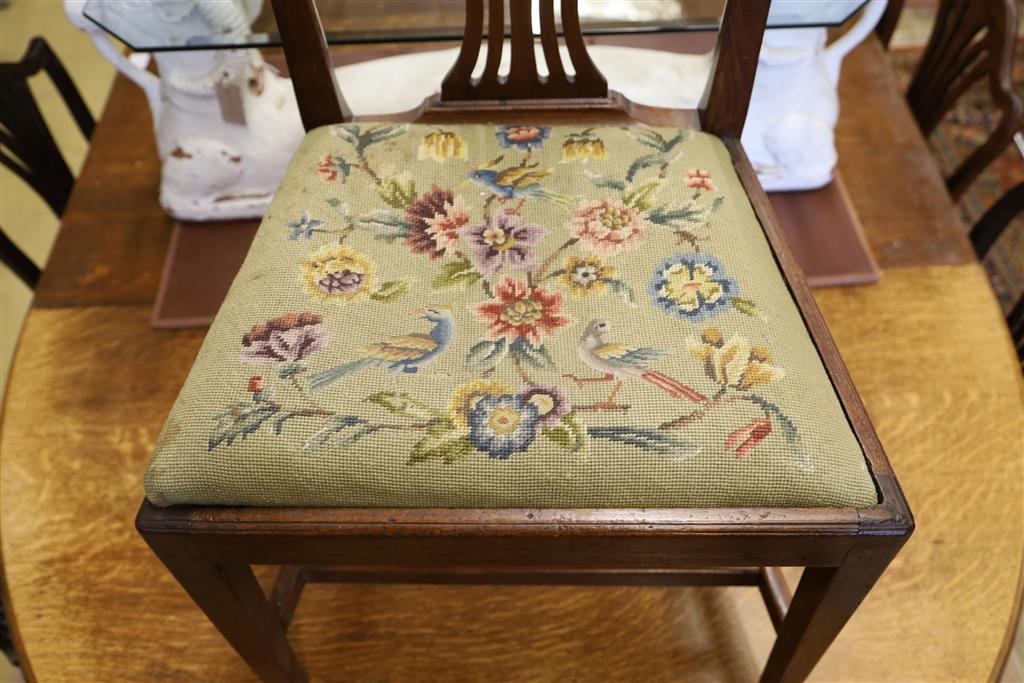 A harlequin set of eight Hepplewhite style mahogany dining chairs with tapestry drop in seats